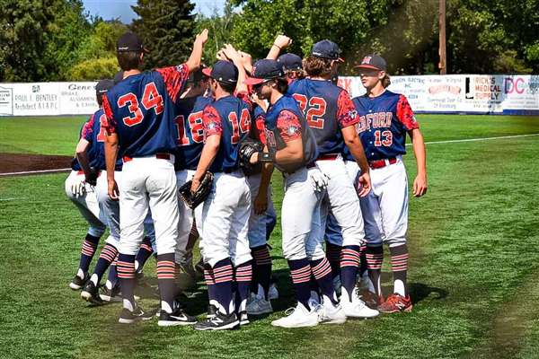 Medford Mustangs 2021 team huddle celebration