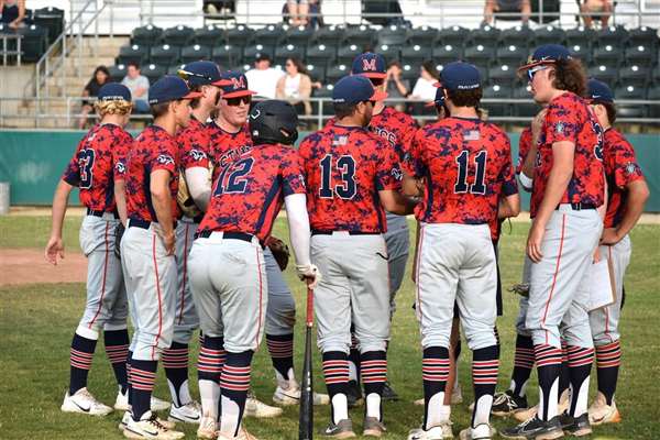Medford Mustangs 2023 team huddle on field