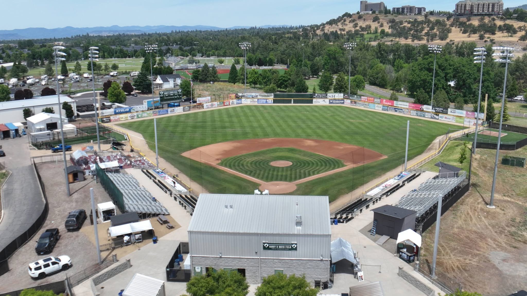 Aerial view of the infield, grandstand, and clubhouse at Harry & David Field in Medford, Oregon.