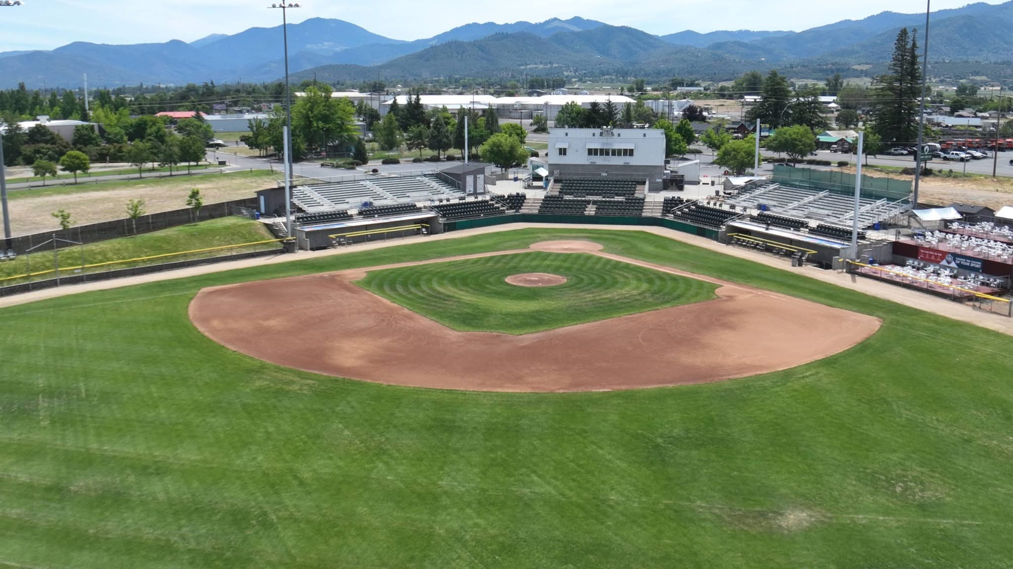 Aerial view of Harry & David Field in Medford, Oregon with the Rogue Valley mountains behind the outfield &mdash; host venue for the 2026 American Legion Baseball Northwest Regional (Region 7).