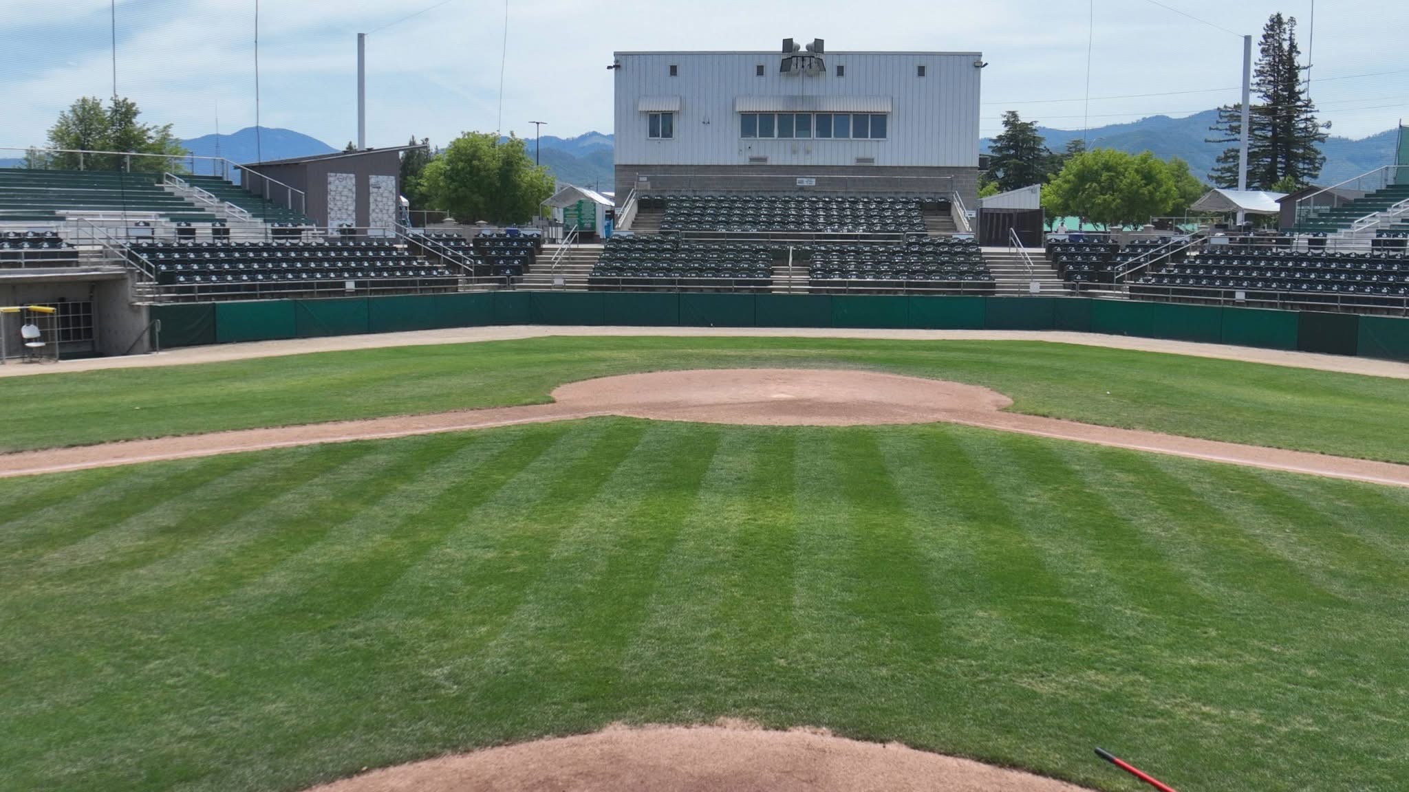 Grandstand seating and the press box at Harry & David Field viewed from the field in Medford, Oregon.